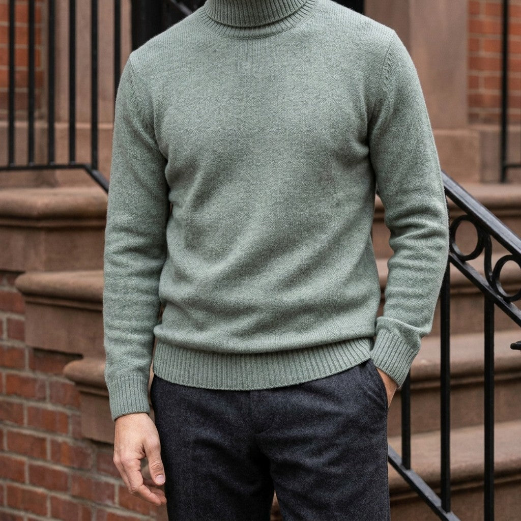 Pistoia Merino Wool Turtleneck — Sage, worn on a brownstone stoop