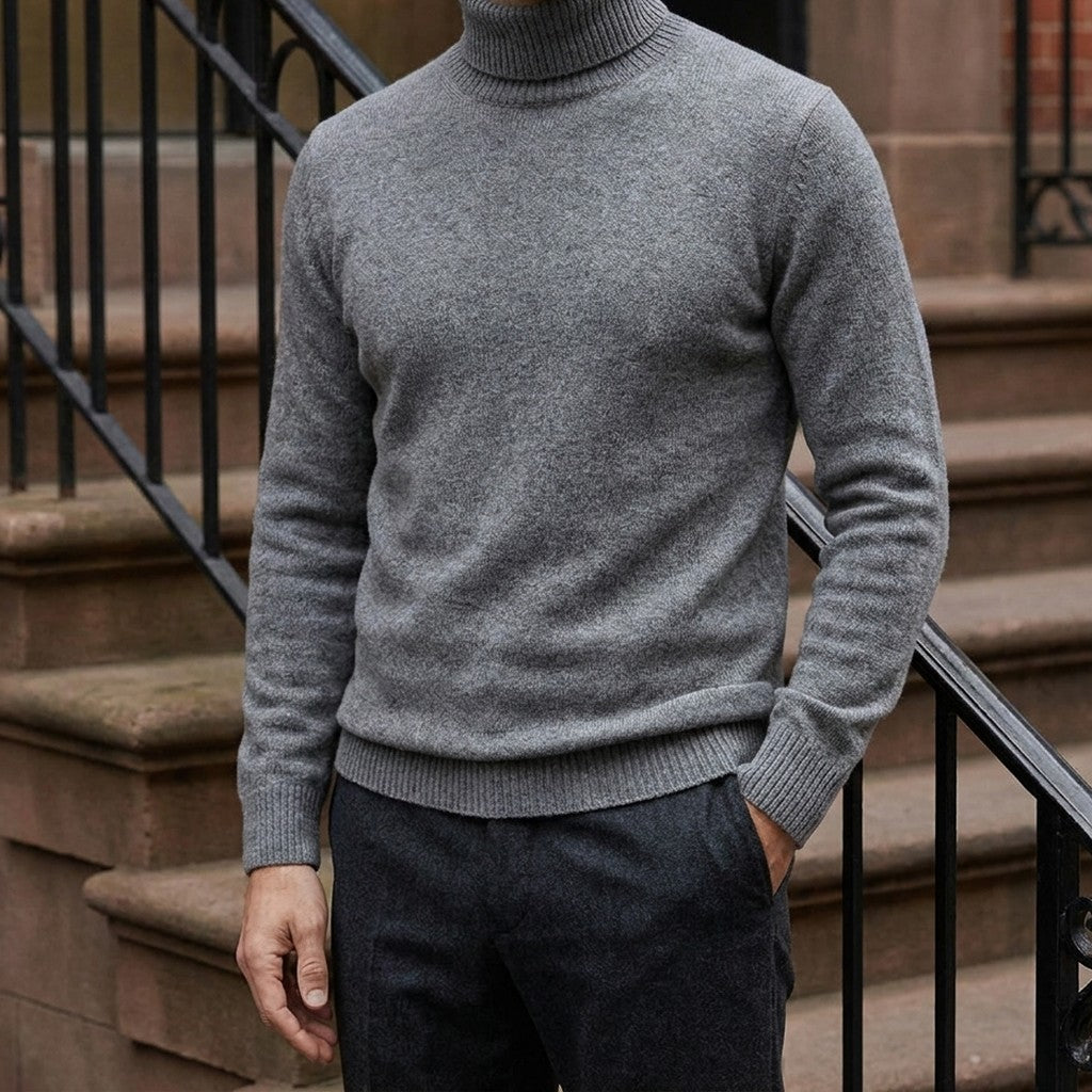Pistoia Merino Wool Turtleneck — Charcoal, worn on a brownstone stoop