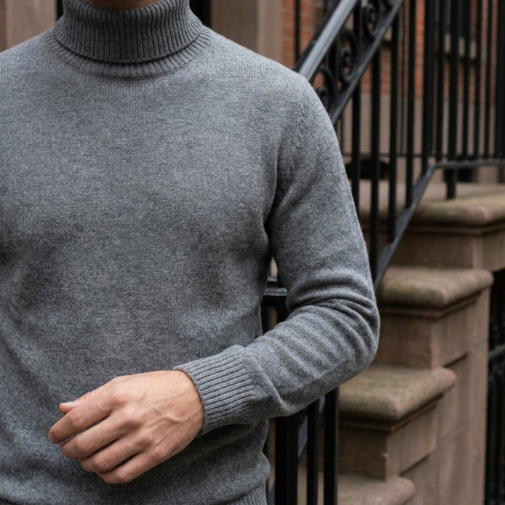 Pistoia Merino Wool Turtleneck — Charcoal, worn close-up of the cuff and knit