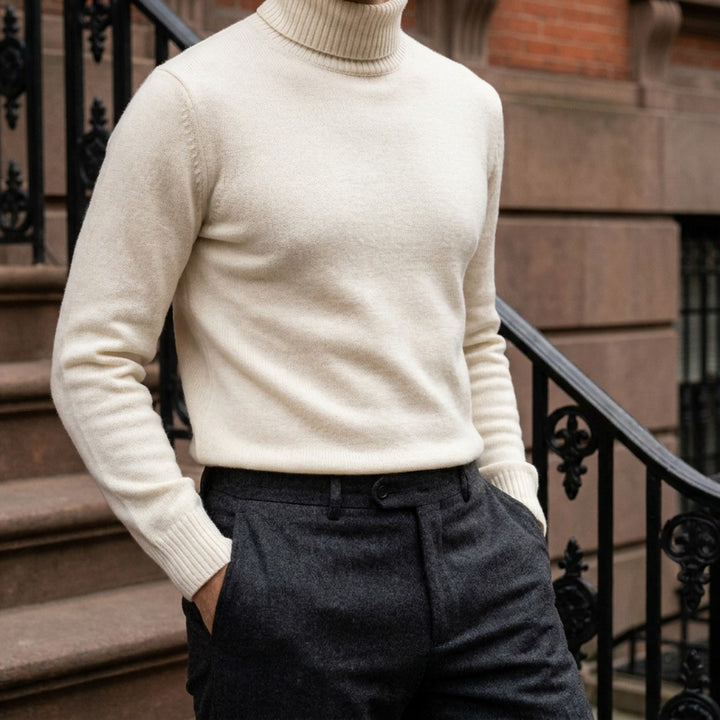 Pistoia Merino Wool Turtleneck — Cream, worn on a brownstone stoop