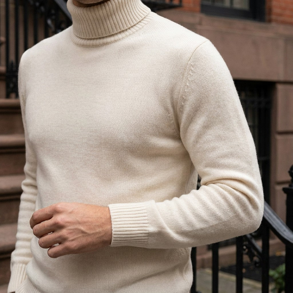 Pistoia Merino Wool Turtleneck — Cream, worn close-up of the cuff and knit