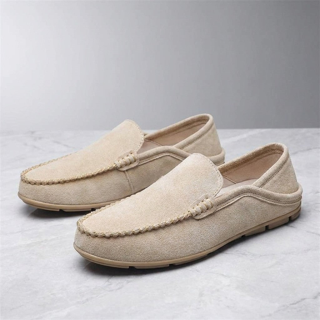 Varazze Suede Loafers — Khaki, pair of loafers, three-quarter view on light grey marble
