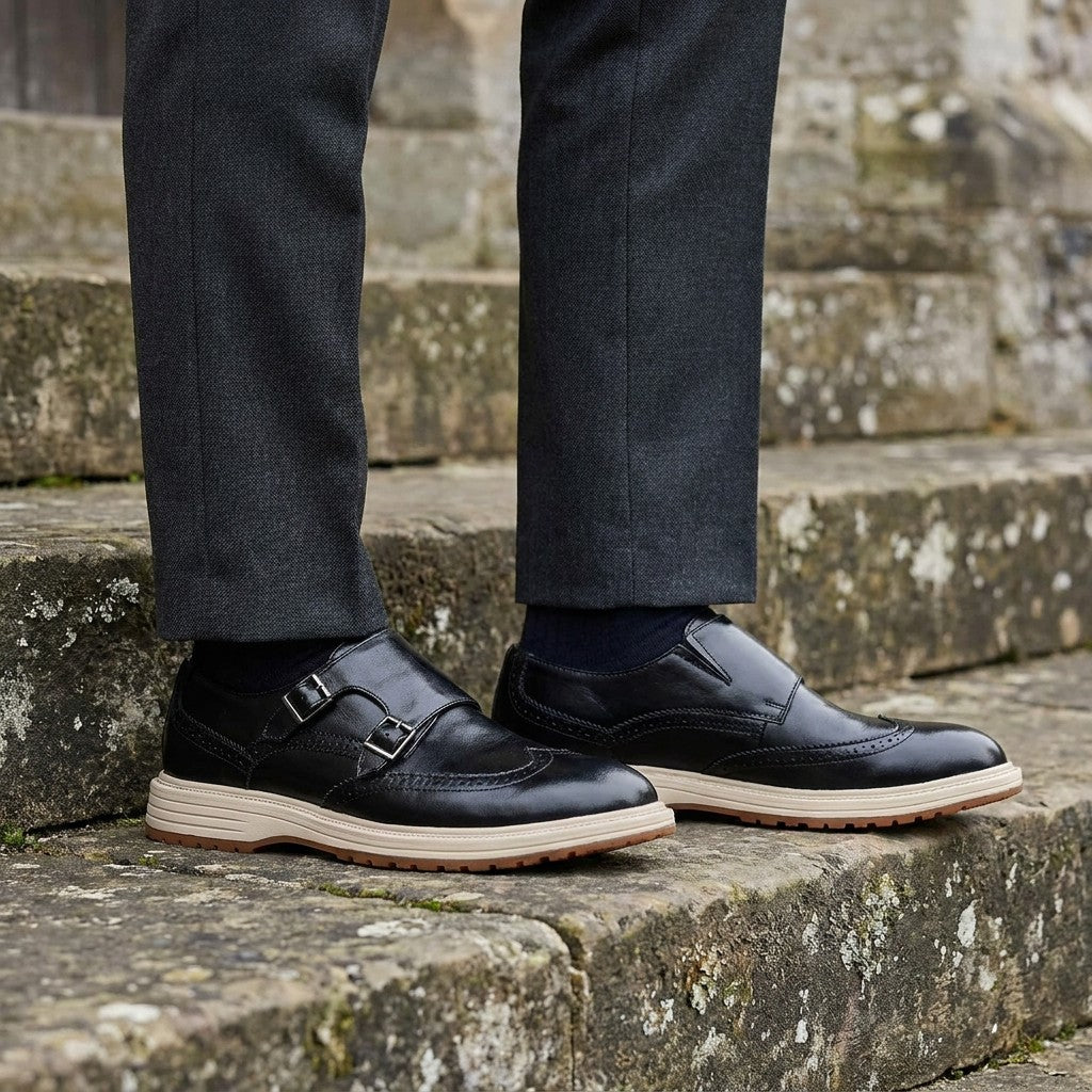 Vignola Wingtip Monk Shoes — Black, worn on church stone steps