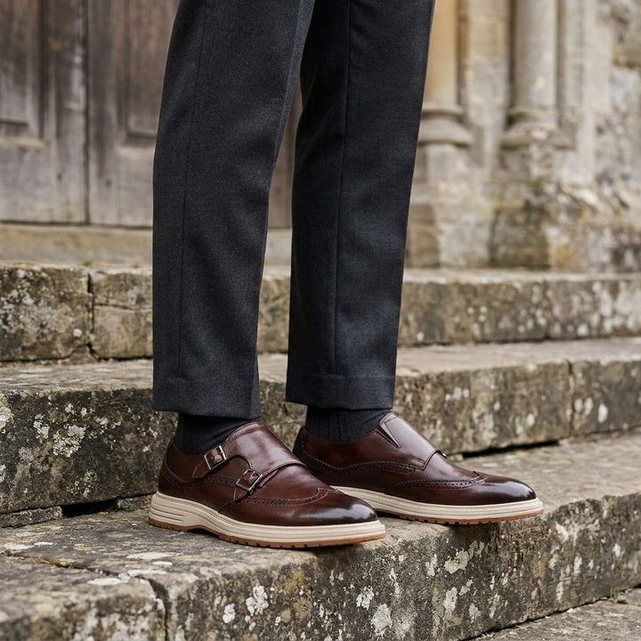 Vignola Wingtip Monk Shoes — Brown, worn on church stone steps